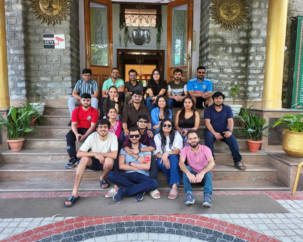 Team group photo on heritage building steps