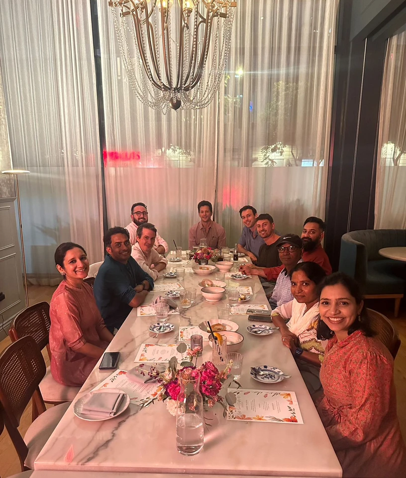 Team dinner at restaurant with chandelier