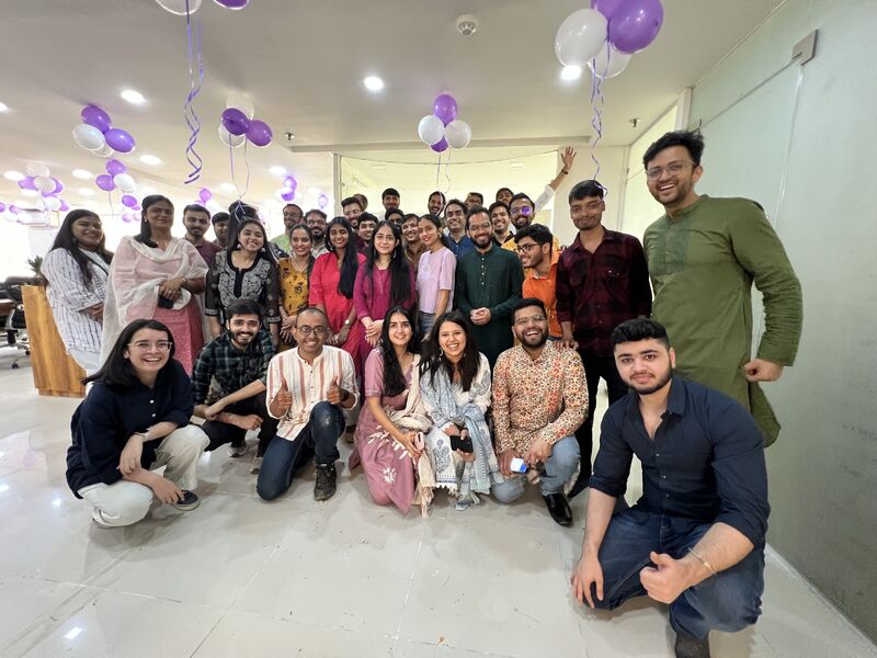 Office party celebration in ethnic wear with balloons
